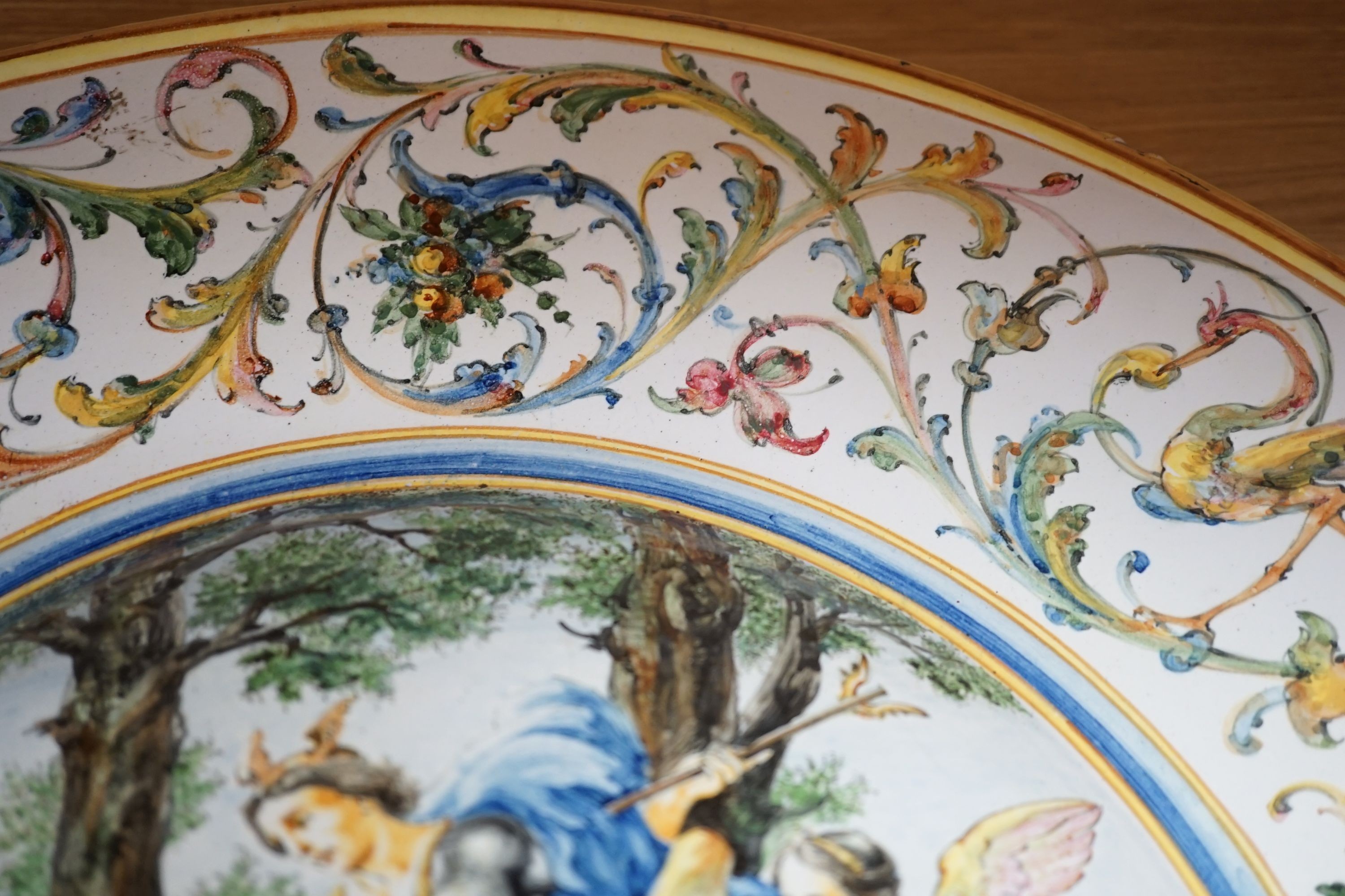 A 19th century large Italian majolica charger, AVF mark, 55cm high.